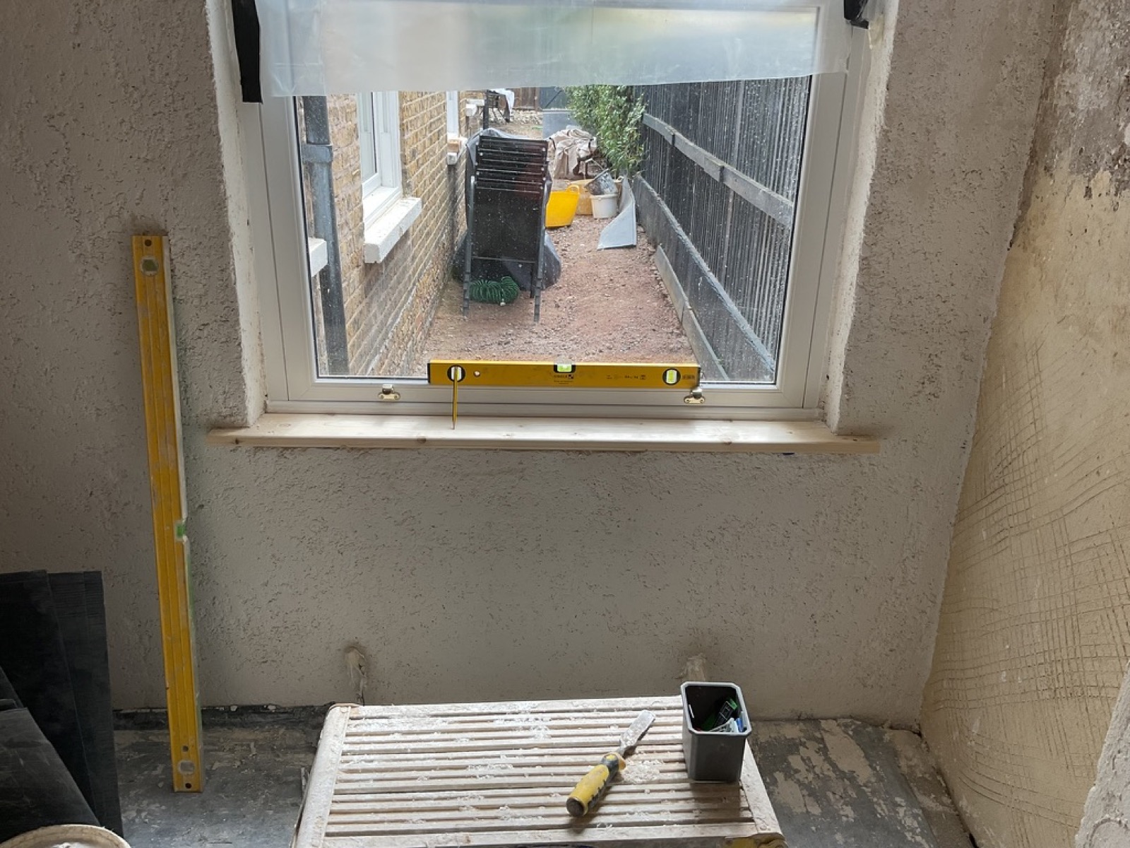 Breathable lime basecoat applied around period window